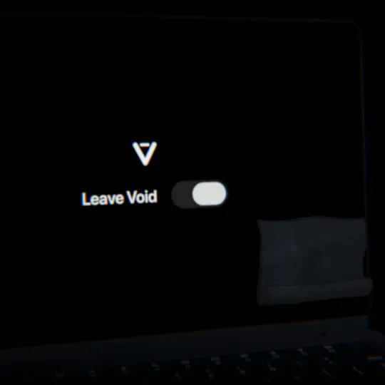 A MacBook with a black screen and a Leave Void switch while a cloth wipes it